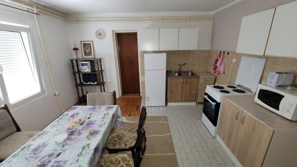 Kuchyň nebo kuchyňský kout v ubytování Apartman Progresso