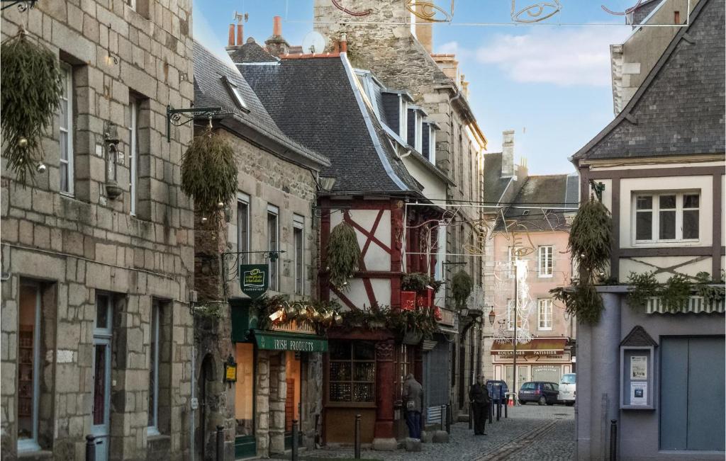 an alley in a city with buildings at Awesome Home In Paimpol With Kitchen in Paimpol