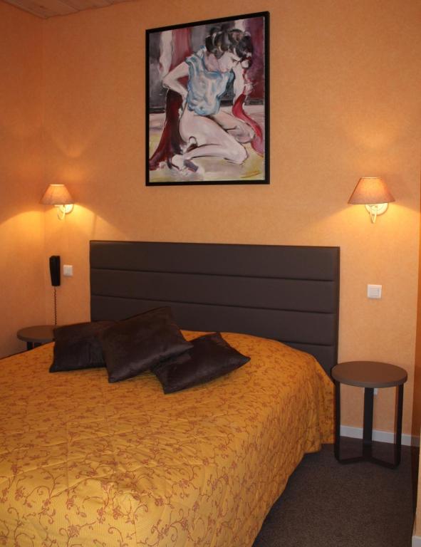 Postel nebo postele na pokoji v ubytování Hôtel Restaurant Taillard