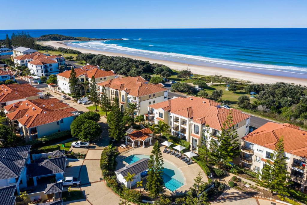 an aerial view of a resort with a beach at The Sands Resort at Yamba in Yamba