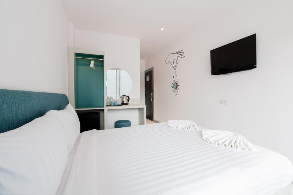 Postel nebo postele na pokoji v ubytování Moon Budget Hotel