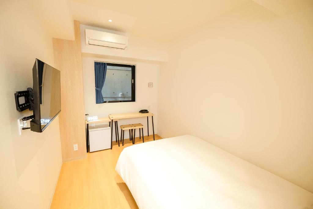 TV a/nebo společenská místnost v ubytování ELE Hotel Kuzuha