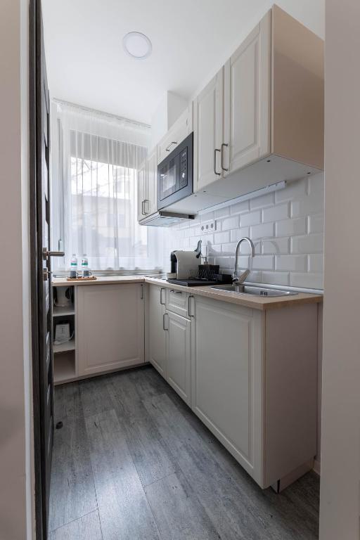 Kuchyň nebo kuchyňský kout v ubytování Roomstore Studio Apartments