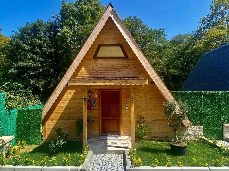 a small wooden house with a pitched roof at Şile de Eşsiz Bungalov 2+1 Ev in Sile