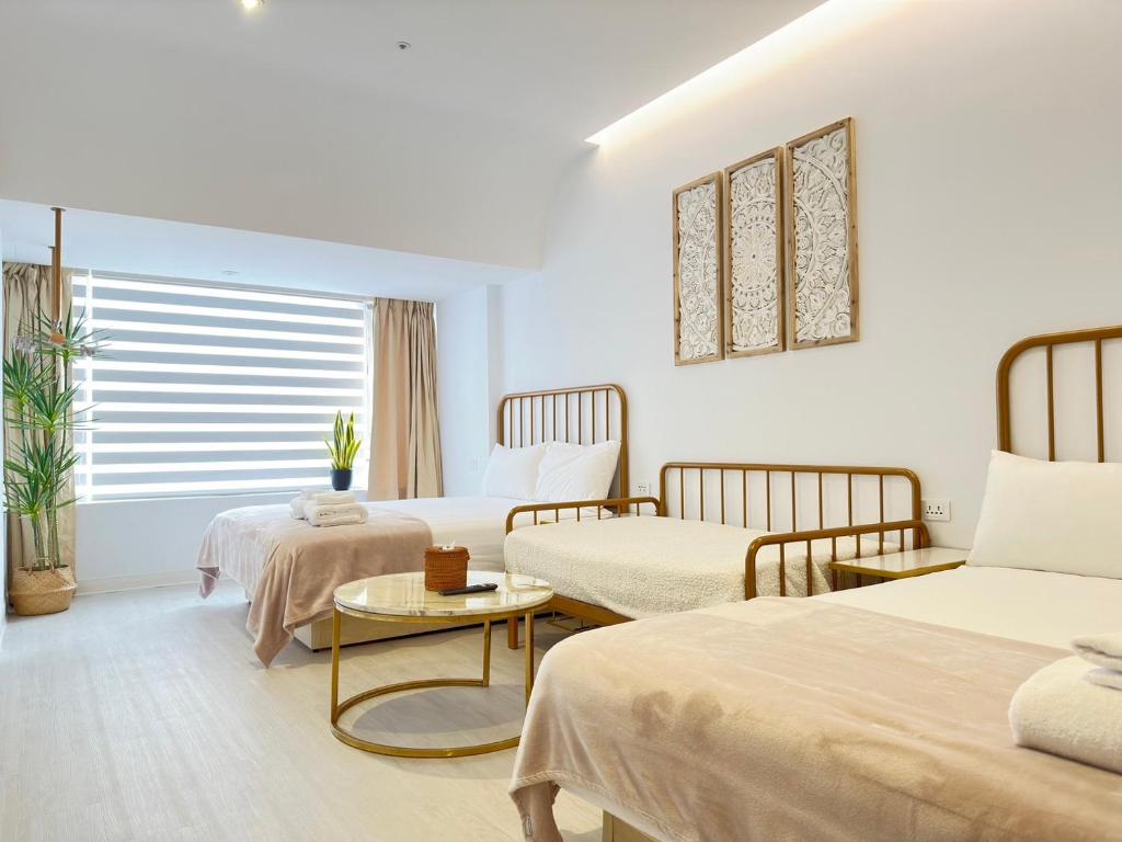 Postel nebo postele na pokoji v ubytování Urban Abode Apartment 1