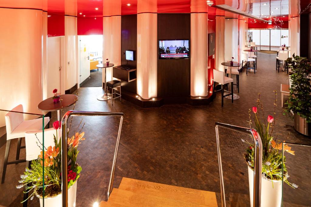 TV a/nebo společenská místnost v ubytování Hotel Roth am Strande