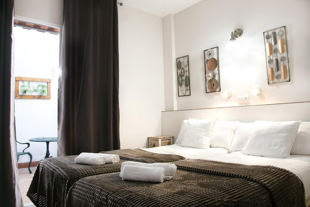 Postel nebo postele na pokoji v ubytování Hostal Cuevas