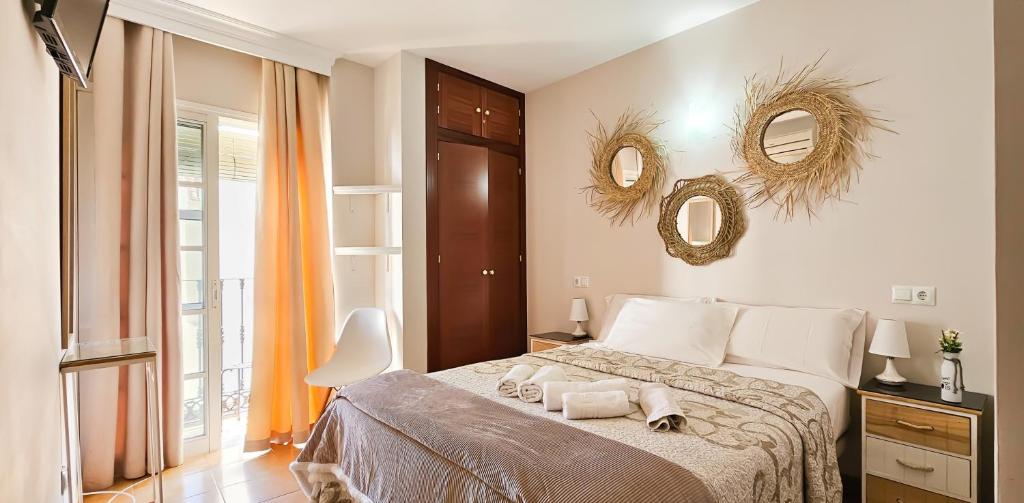 Postel nebo postele na pokoji v ubytování Hostal Cuevas