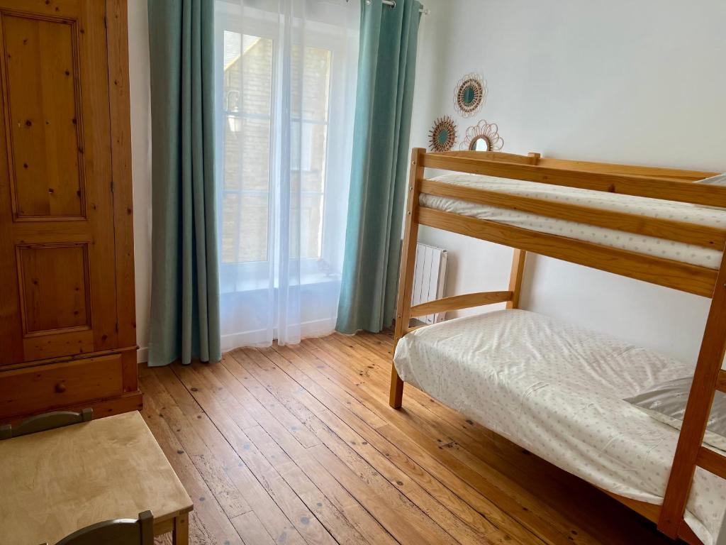 Postel nebo postele na pokoji v ubytování Le Clos des écureuils