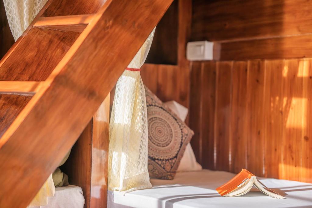Postel nebo postele na pokoji v ubytování Rainbow Hostelier