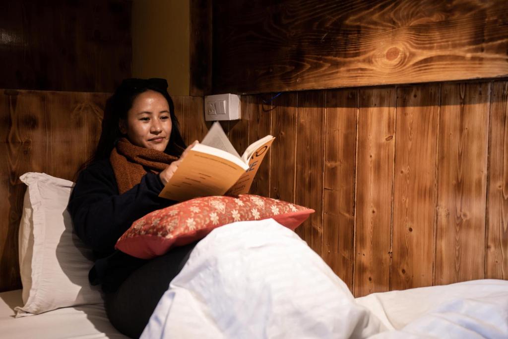 Postel nebo postele na pokoji v ubytování Rainbow Hostelier