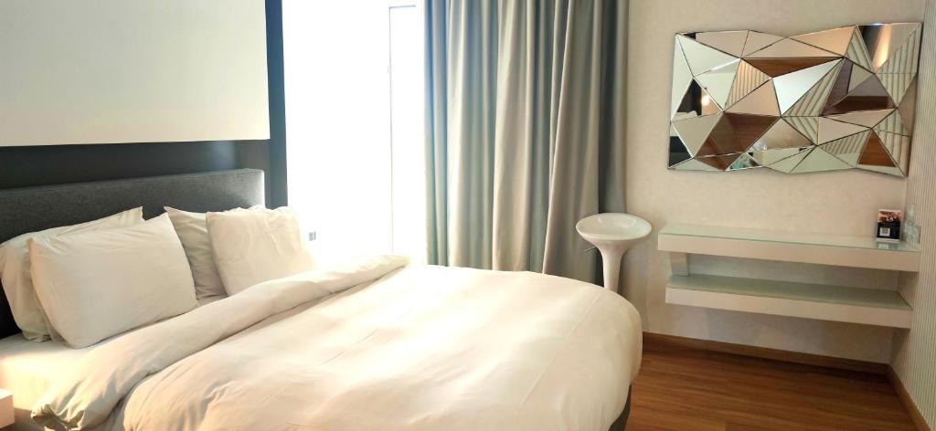 Posteľ alebo postele v izbe v ubytovaní Mirada Hotel