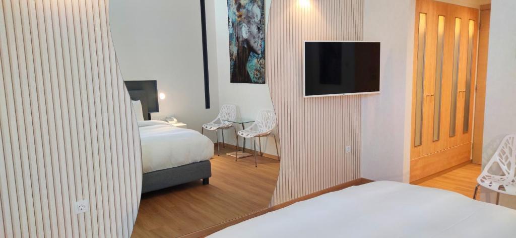 Posteľ alebo postele v izbe v ubytovaní Mirada Hotel