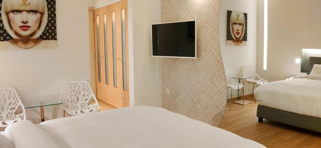 Posteľ alebo postele v izbe v ubytovaní Mirada Hotel