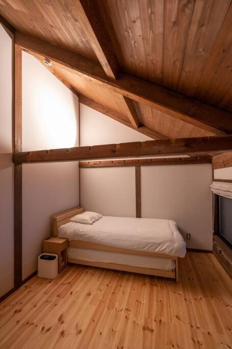 Postel nebo postele na pokoji v ubytování MITSU-House