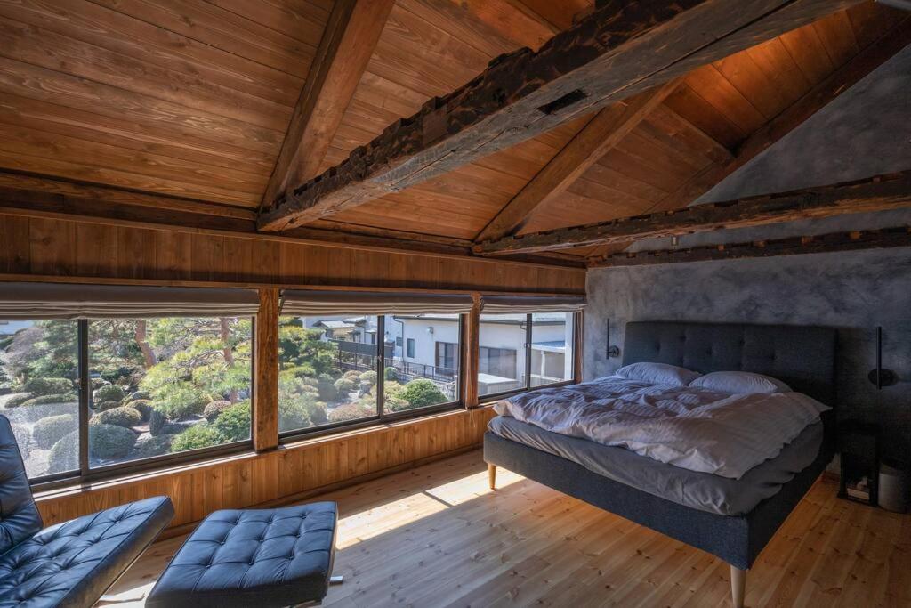 Postel nebo postele na pokoji v ubytování MITSU-House