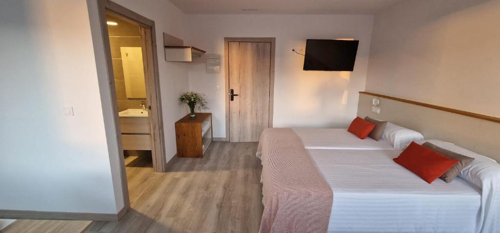 Posteľ alebo postele v izbe v ubytovaní Estudios en Plaza Cabo da Vila centro Muxia