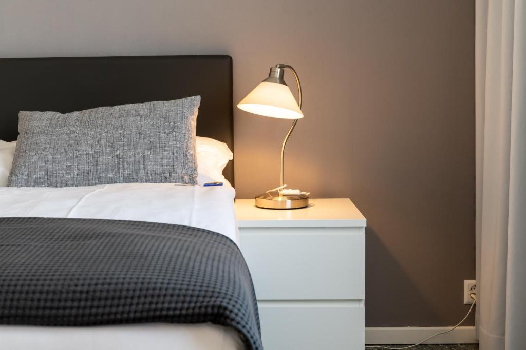 Postel nebo postele na pokoji v ubytování Hotel Sursee