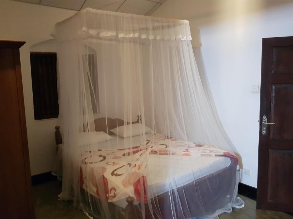 Postel nebo postele na pokoji v ubytování Chitra Ayurveda