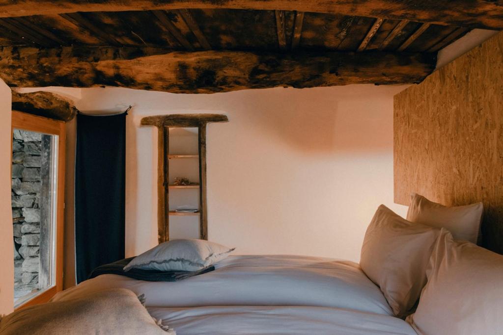 En eller flere senger på et rom på Corippo Albergo Diffuso