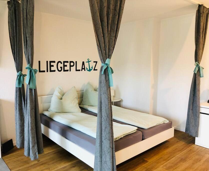 a bedroom with a bed with a sign that reads leperpunk at Zentrale Studio Wohnung in Emden in Emden