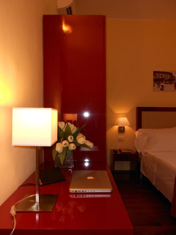Postel nebo postele na pokoji v ubytování Hotel Minerva