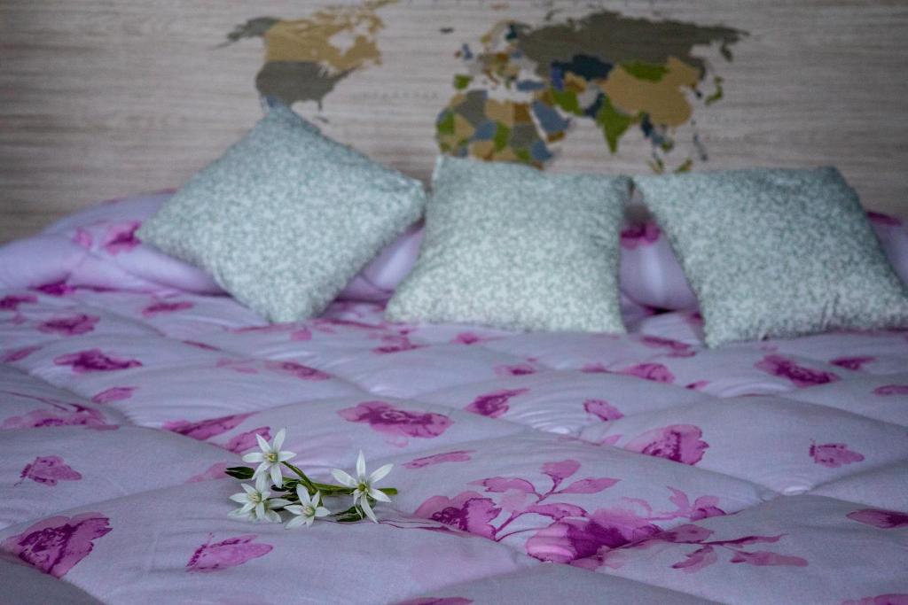 Postel nebo postele na pokoji v ubytování B&B LA MIMOSA E IL GELSOMINO