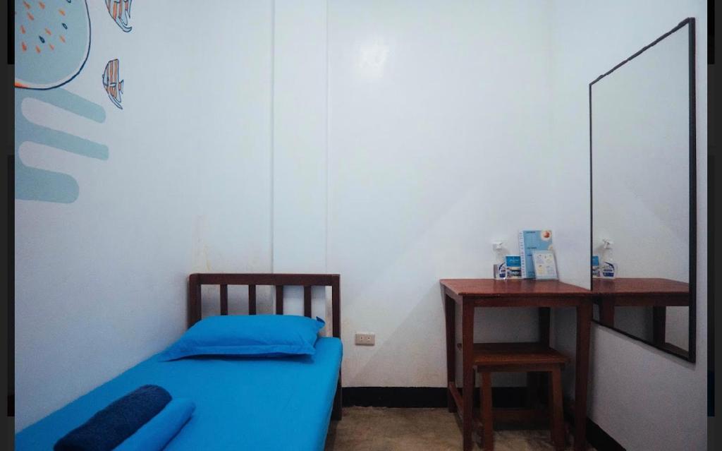 Postel nebo postele na pokoji v ubytování Tres Islas Hostel