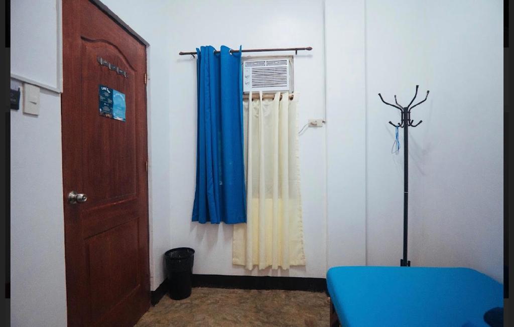 Postel nebo postele na pokoji v ubytování Tres Islas Hostel