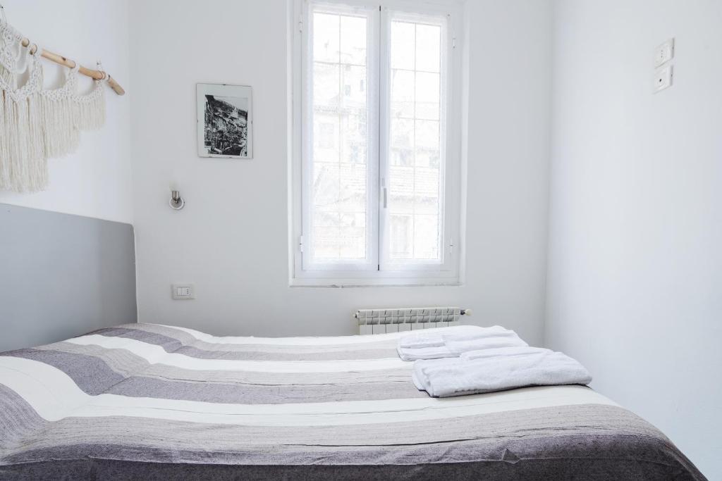 Postel nebo postele na pokoji v ubytování Banchi