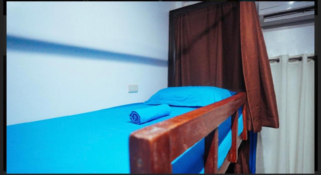 Postel nebo postele na pokoji v ubytování Tres Islas Hostel