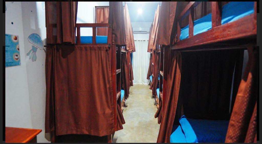 Postel nebo postele na pokoji v ubytování Tres Islas Hostel