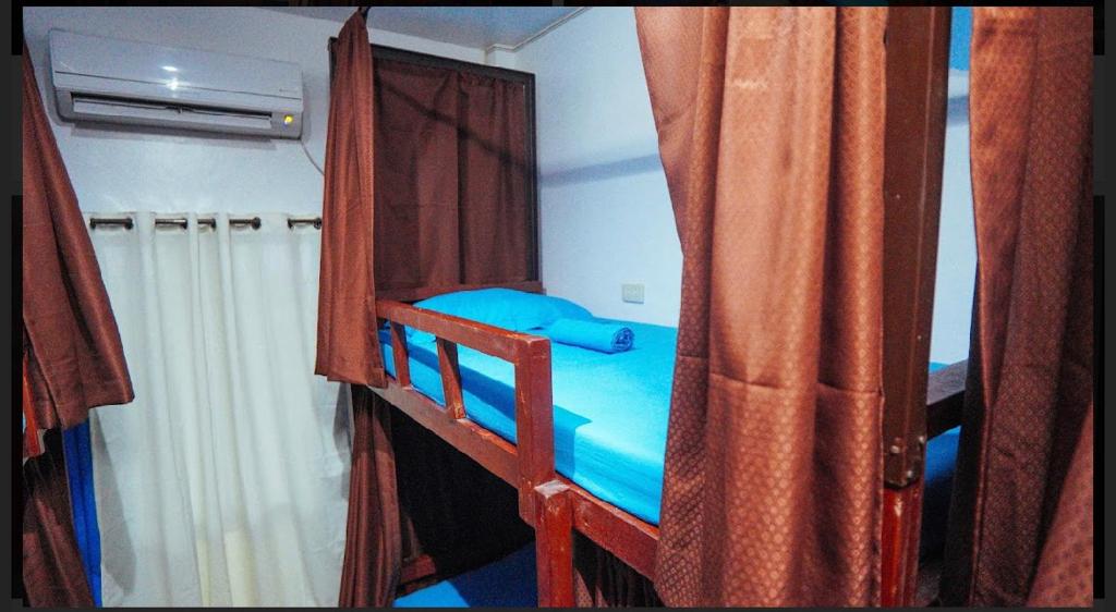 Postel nebo postele na pokoji v ubytování Tres Islas Hostel
