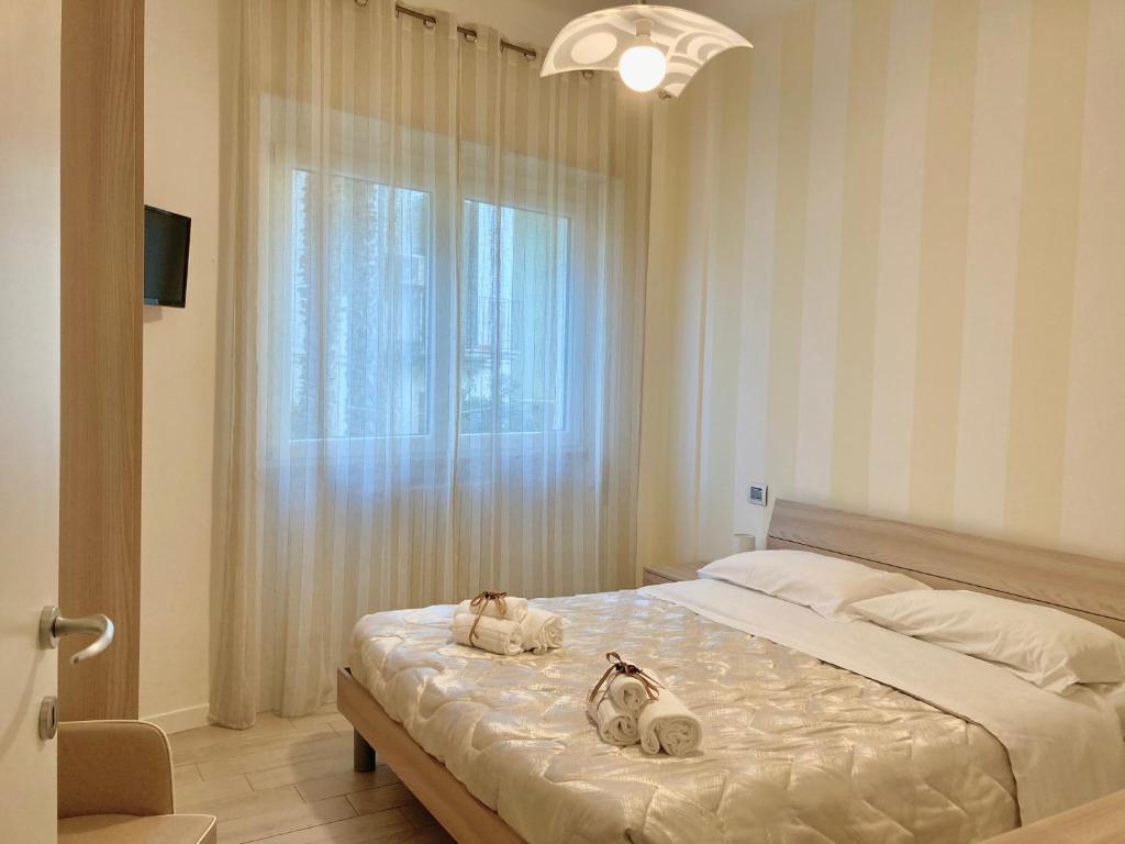 Łóżko lub łóżka w pokoju w obiekcie La Boa B&B