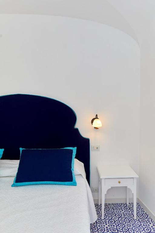 Postel nebo postele na pokoji v ubytování Hotel Conca d'Oro