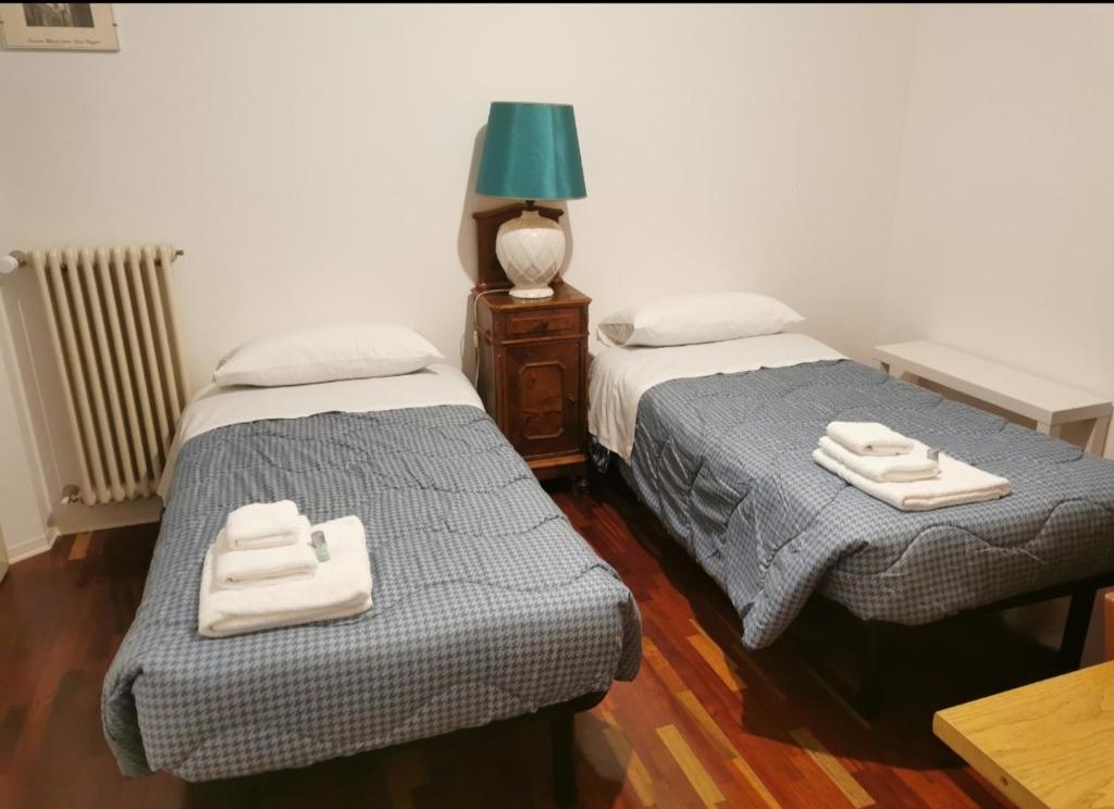 A bed or beds in a room at B&B La Chicca