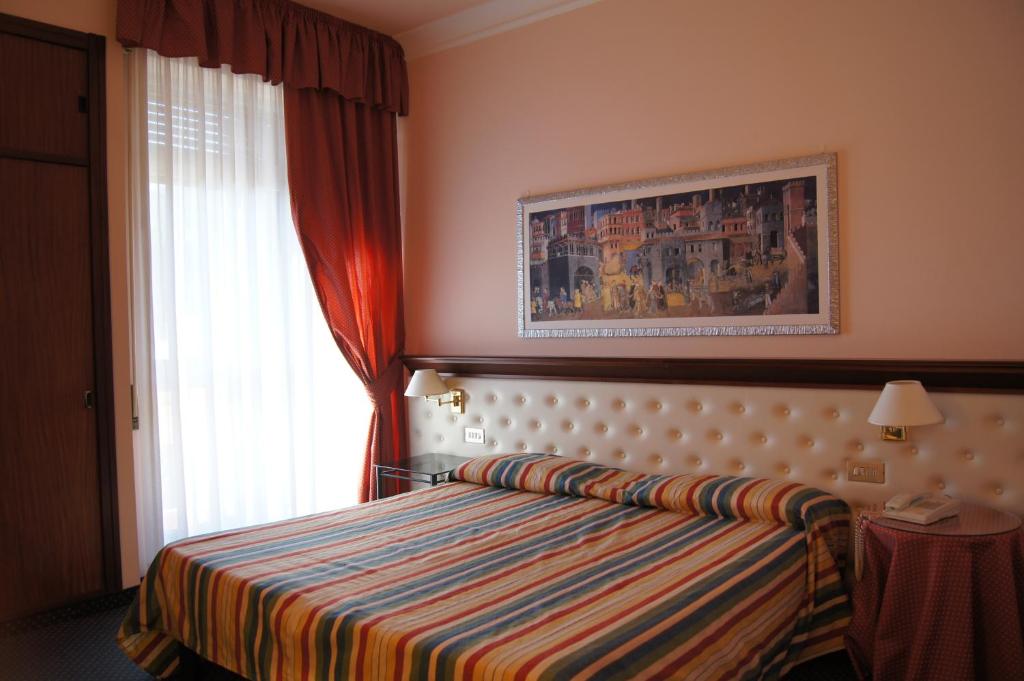 Postel nebo postele na pokoji v ubytování Hotel Torretta
