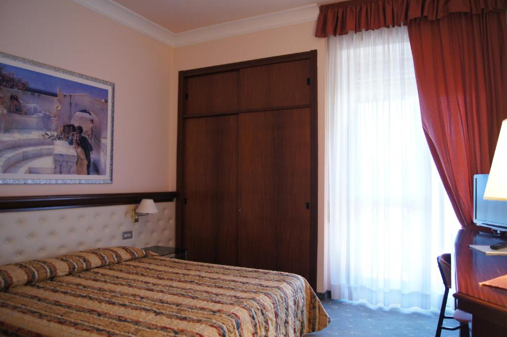Postel nebo postele na pokoji v ubytování Hotel Torretta