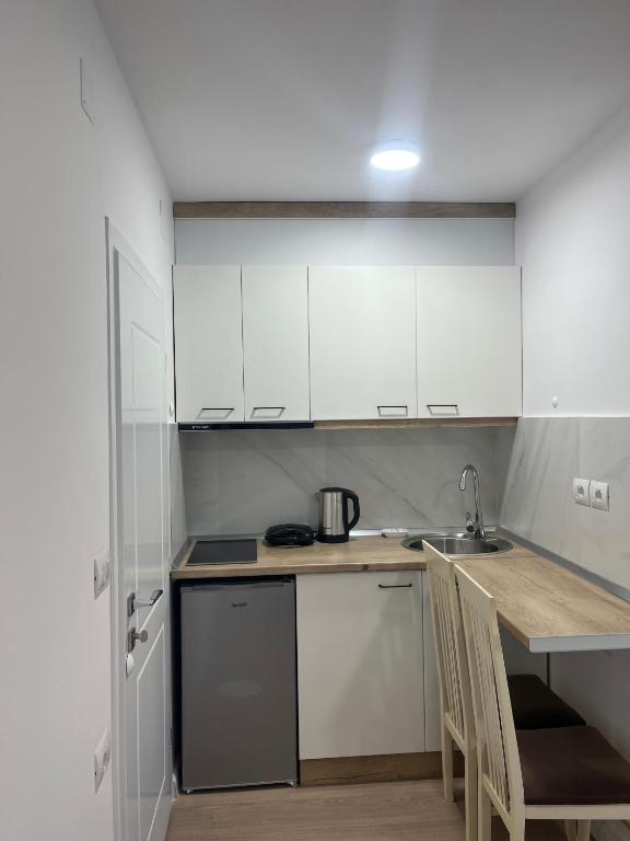 Kuchyň nebo kuchyňský kout v ubytování Viva Apartments