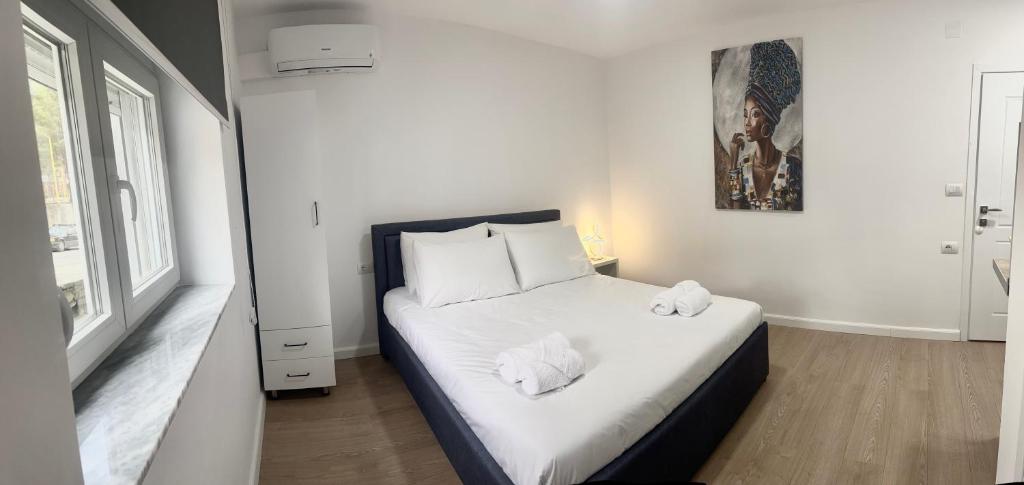 Postel nebo postele na pokoji v ubytování Viva Apartments