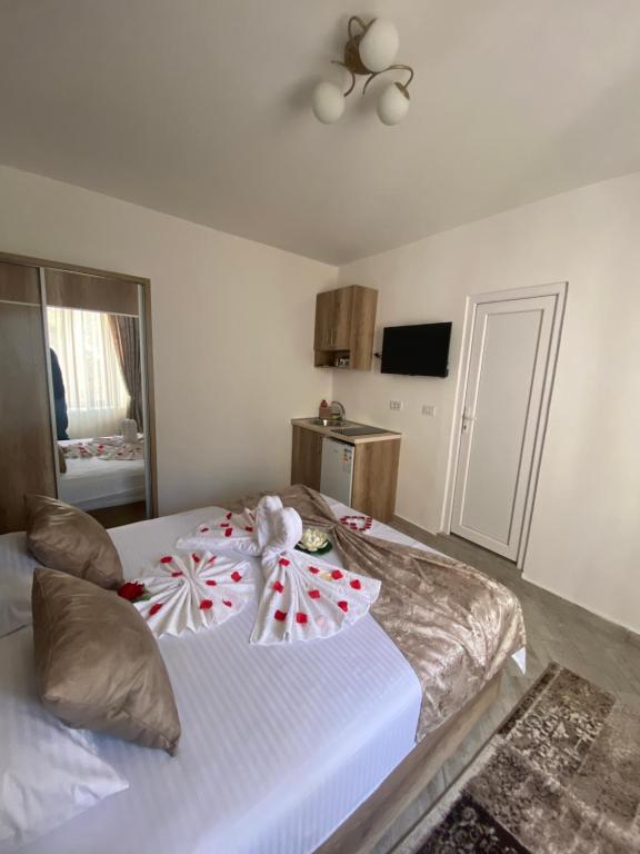 a bedroom with two beds with christmas decorations on them at Apartments Gusar in Ulcinj
