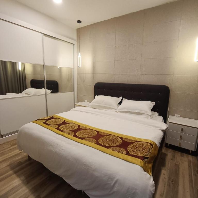 Postel nebo postele na pokoji v ubytování Mega Inn