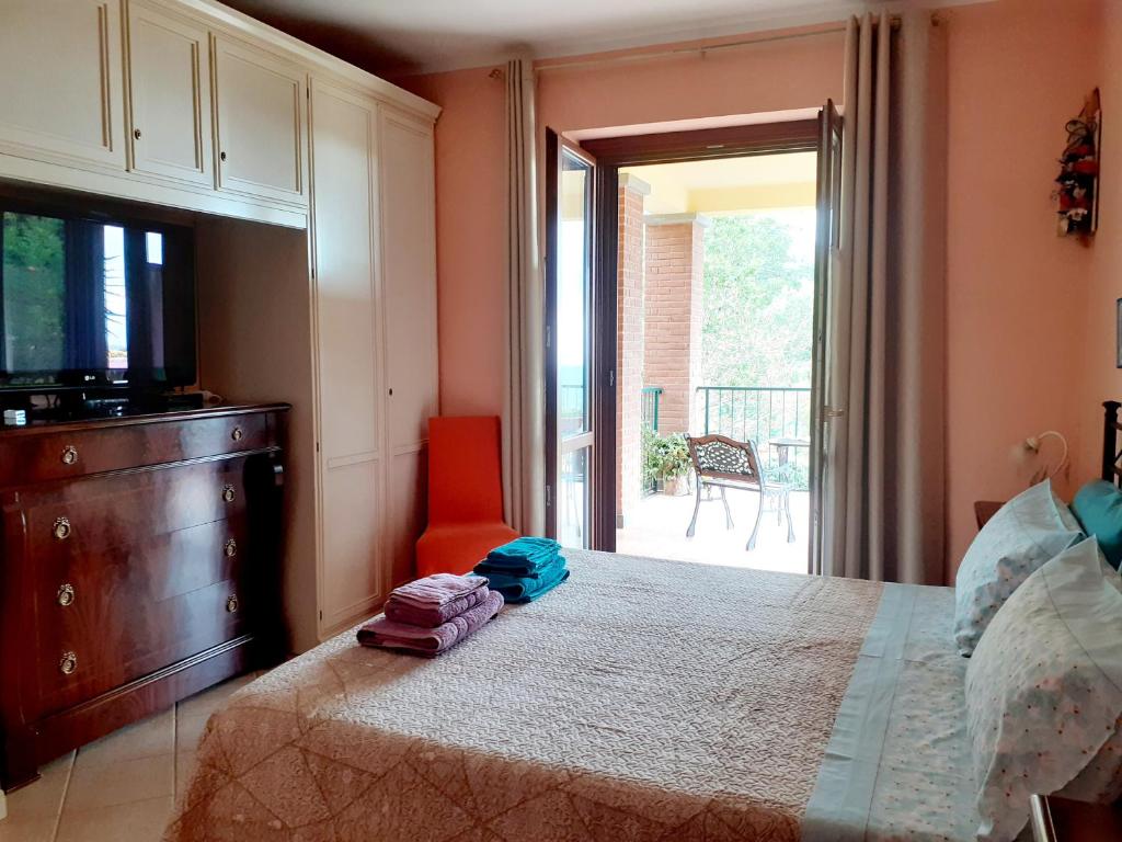 Postel nebo postele na pokoji v ubytování La Casa Più Sù