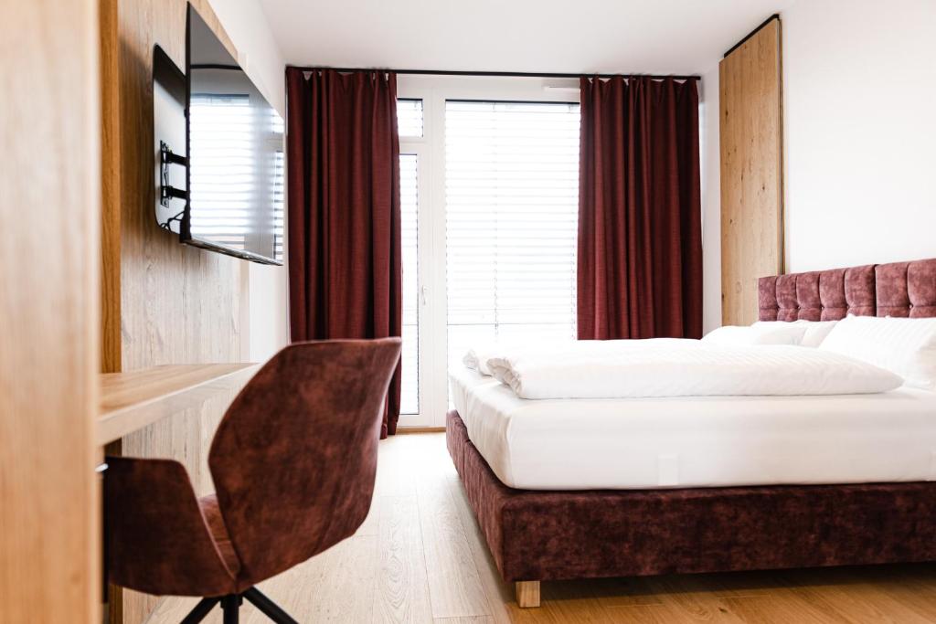Postel nebo postele na pokoji v ubytování Boardinghouse Plattling