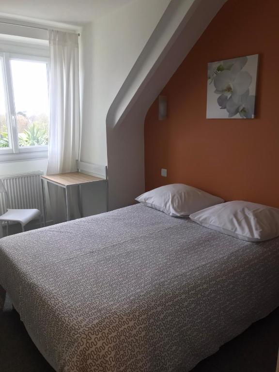 Postel nebo postele na pokoji v ubytování Hôtel du Littoral