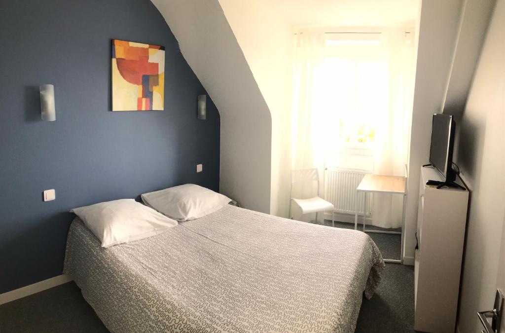 Postel nebo postele na pokoji v ubytování Hôtel du Littoral