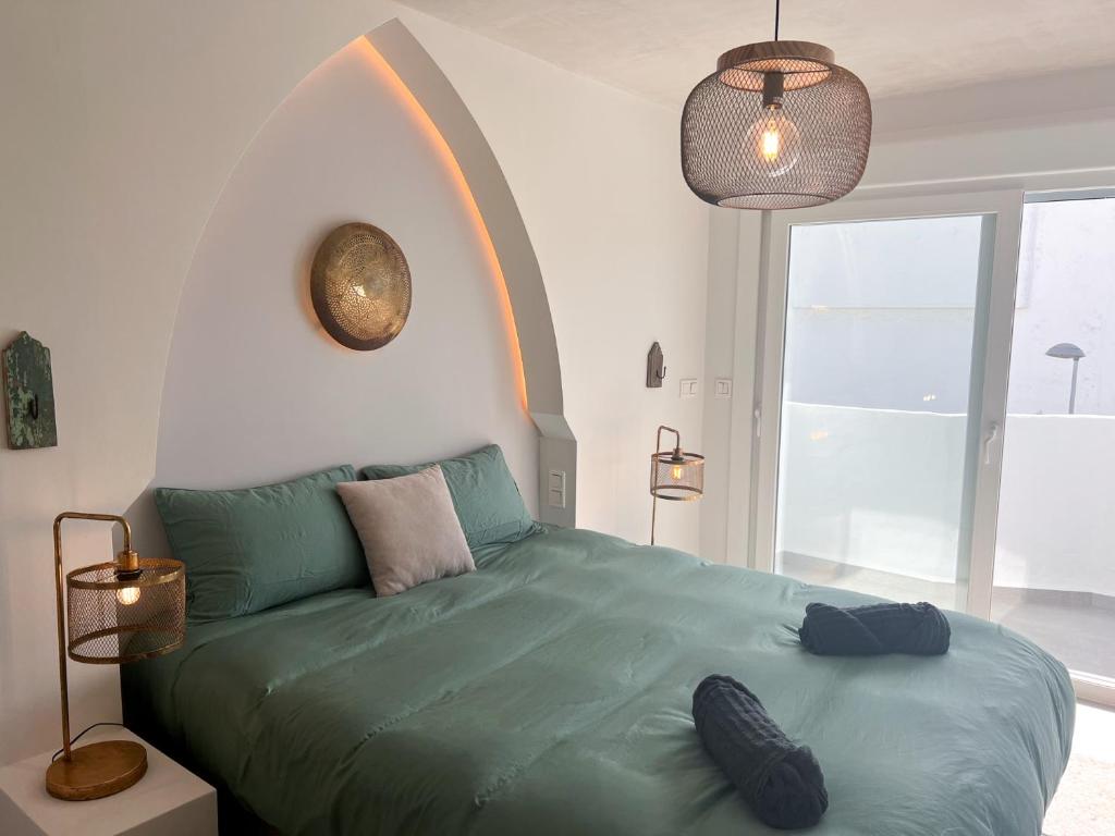 Posteľ alebo postele v izbe v ubytovaní Tarifa Cozy House, Casa Blanca