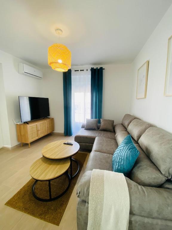 a living room with a couch and a table at Arunda Home in Ronda