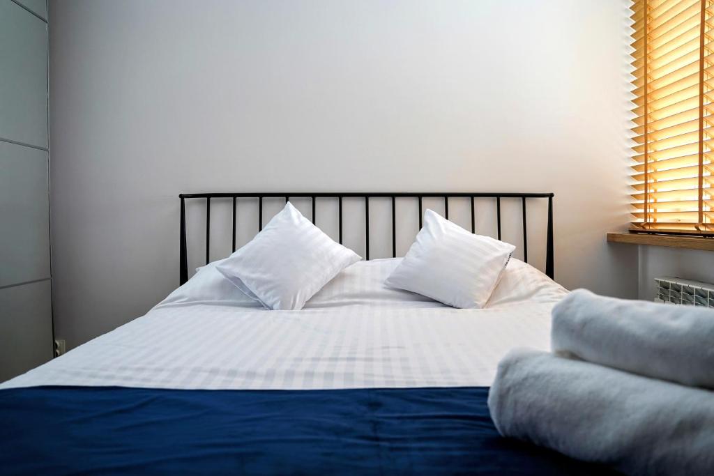 Postel nebo postele na pokoji v ubytování Apartament 914
