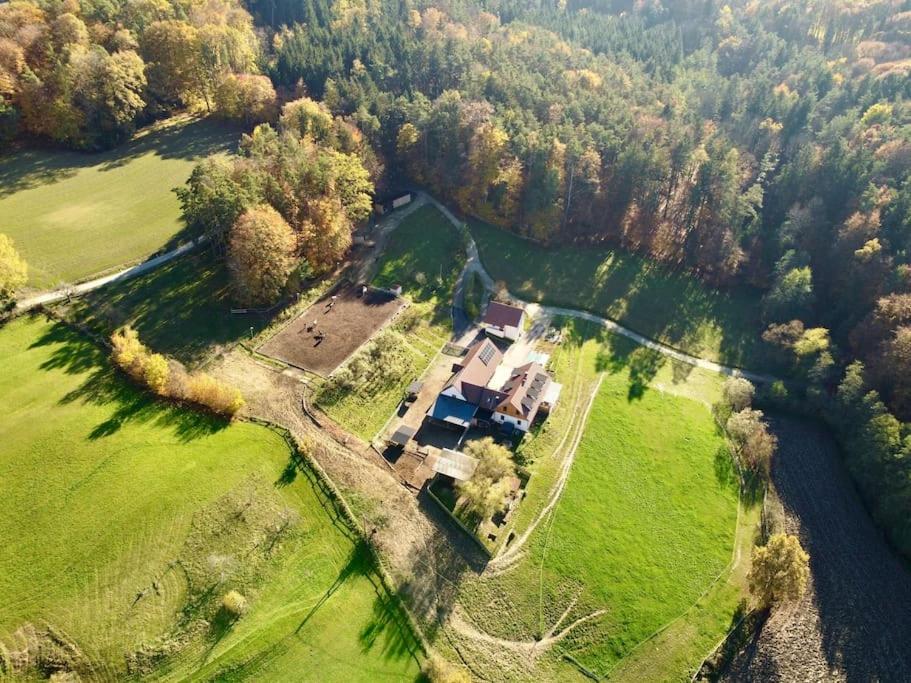 an aerial view of a house in a field at Kellerstöckl am NaturGut Kunterbunt in Hartl